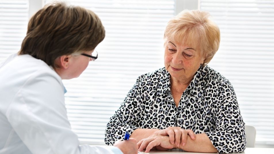 Photo of senior woman in consult with doctor